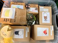 Plastic tote containing boxed faux food items