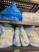 Multiple sealed towel packages on shelving
