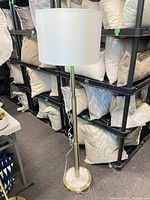 Full view of floor lamp showing shade, pole, base