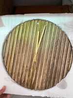 Wood slat wall clock in packaging