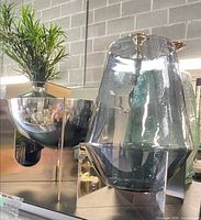 Group shot showing stainless bowl in stand and glass hurricane
