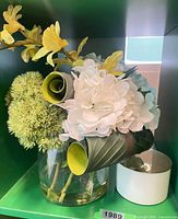 Floral arrangement, ceramic jar visible