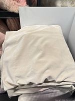 Folded beige drape panel