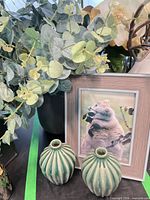 All items together: grey vase with faux eucalyptus, pair green bud vases, brown picture frame