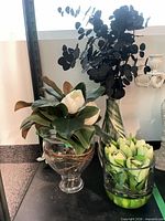 All three vases with faux floral arrangements on shelf