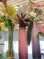 Group shot of all three vases showing colors and floral arrangements