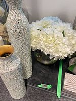 Group shot of hydrangea arrangement and two mosaic vases
