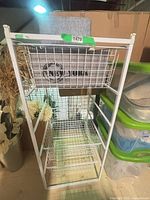 Grey felt basket and grey linen "NEW YORK" storage box on shelving unit