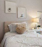 Duvet cover on twin bed showing overall pintuck pattern