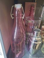 Pink glass swing-top bottle, ribbed tumbler, stainless shaker