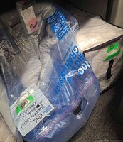 Coverlet and grey boho bedding set in storage bags
