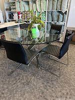 Table with four of the five chairs arranged around it