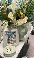 Pair of mint green vases with faux magnolia stems, trinket box, grey frame