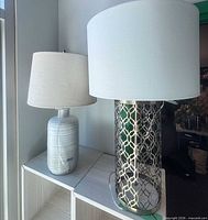 Both lamps side by side showing relative size and style