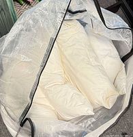 Open bag showing multiple white pillow inserts inside