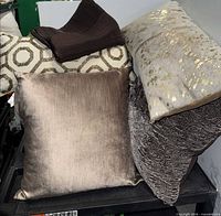 Group of assorted pillows showing materials and cover
