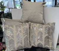 Group shot showing four of the five decorative pillows