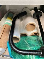 Stretch-wrap rolls and dispenser handle in tray