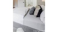 Staged photo of bedding demonstrating colour and texture
