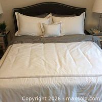 Set displayed on bed showing duvet cover, shams and toss cushion