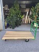 Actual Uline wood platform truck in warehouse entrance
