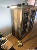 Lamp illuminated beside cabinet showing overall design