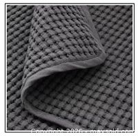 Close-up of waffle-texture dark grey blanket