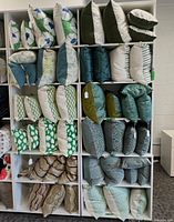 Front view of shelving units loaded with pillows showing overall structure