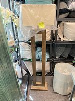 Full view of wood floor lamp with shade