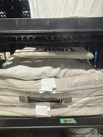 Stacked woven-fabric yoga cushions on shelf