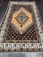 Full view of handmade wool rug showing entire design and fringe