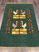 Full view of rug showing overall design and fringe
