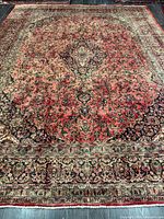 Full view of entire rug showing central medallion and borders