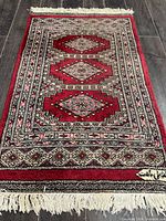 Full view of rug showing entire design and fringe
