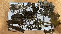 Overview of entire lot on tray showing pulls, backplates, screws