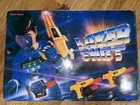 front of Lazer Shot retail box showing artwork, branding and images of guns and targets