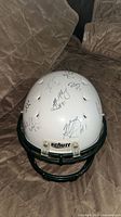 Top view showing multiple signatures across helmet crown