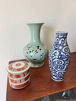 group shot of celadon vase, blue vase, Imari box