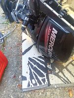 Side view of Mercury FourStroke outboard motor showing cowl and lower unit