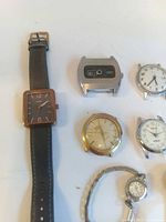 Overview showing all seven watches with varying styles and materials