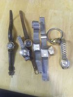 All eight wristwatches laid out for full view