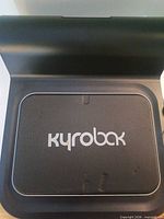 Top view of Kyrobak device with logo