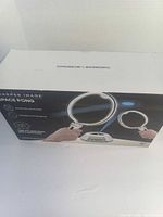 Front view of Sharper Image Space Pong box showing product image and branding