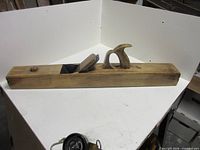 Full left side view of wooden jointer plane