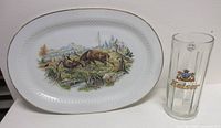 Porcelain platter and glass stein side by side for size comparison