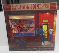 Front cover of sleeve with diner artwork and title graphics