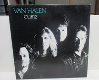 Front jacket showing band portrait and title