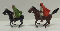 Both lead mounted Arab figures side view