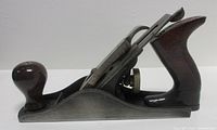 Right side view of complete Stanley Bailey No.4 bench plane showing smooth sole, hardwood tote and knob