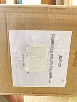 Shipping box showing product label for brushed nickel mini modern bankers lamp